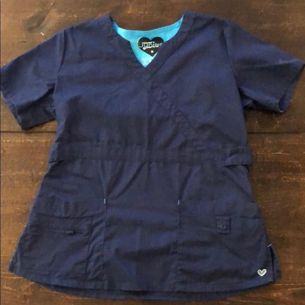 Butter-Soft by UA.  Navy scrubs top M